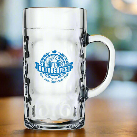 Custom 1L Libbey Oktoberfest Stein with blue logo on a wooden table, ideal for large beer servings.