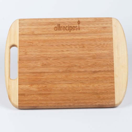 Custom bamboo cutting board with handle, featuring durable construction and engraved logo.