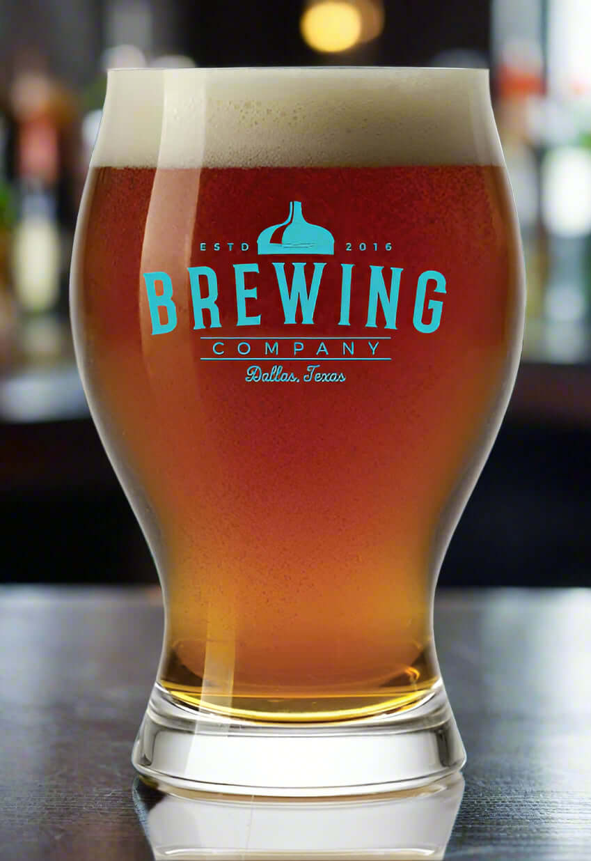 Clear 16 oz Arc Barlow pilsner glass with tall tapered body and wide rim, holding a full-color branded logo printed on one side