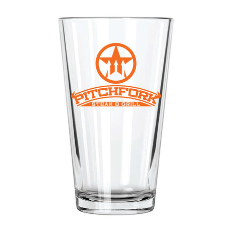 Custom 16 oz clear pint glass featuring Pitchfork Steak & Grill logo in orange.