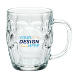 Clear 20 oz Britannia glass beer mug with dimpled sides, round central imprint window displaying a Your Design Here logo, and sturdy handle