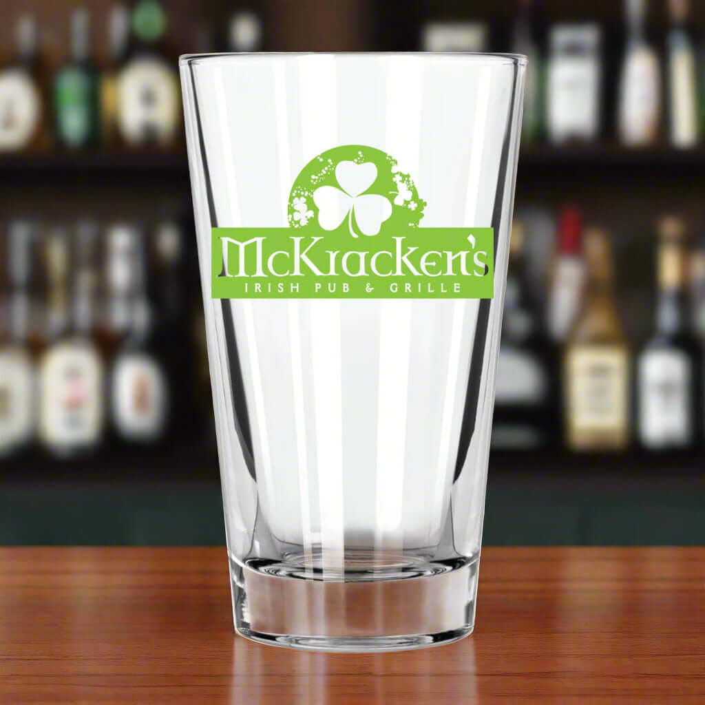 Custom Libbey 14 oz. cooler mixing glass with green logo for McKracken's Irish Pub & Grille, ideal for cocktails and drinks.