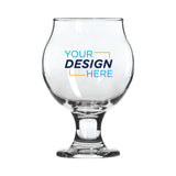 Clear 5 oz Belgian‑style tulip taster glass with short stem and flared rim, featuring full‑color "Your Design Here" logo printed on bowl